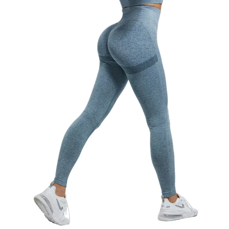 Blue leggings worn by a person on a white background